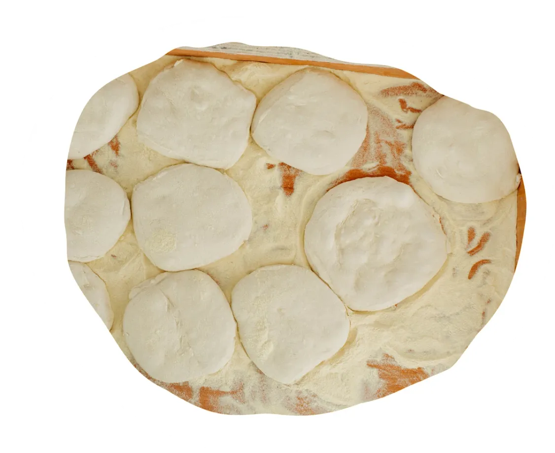 Dough balls proving in a tray